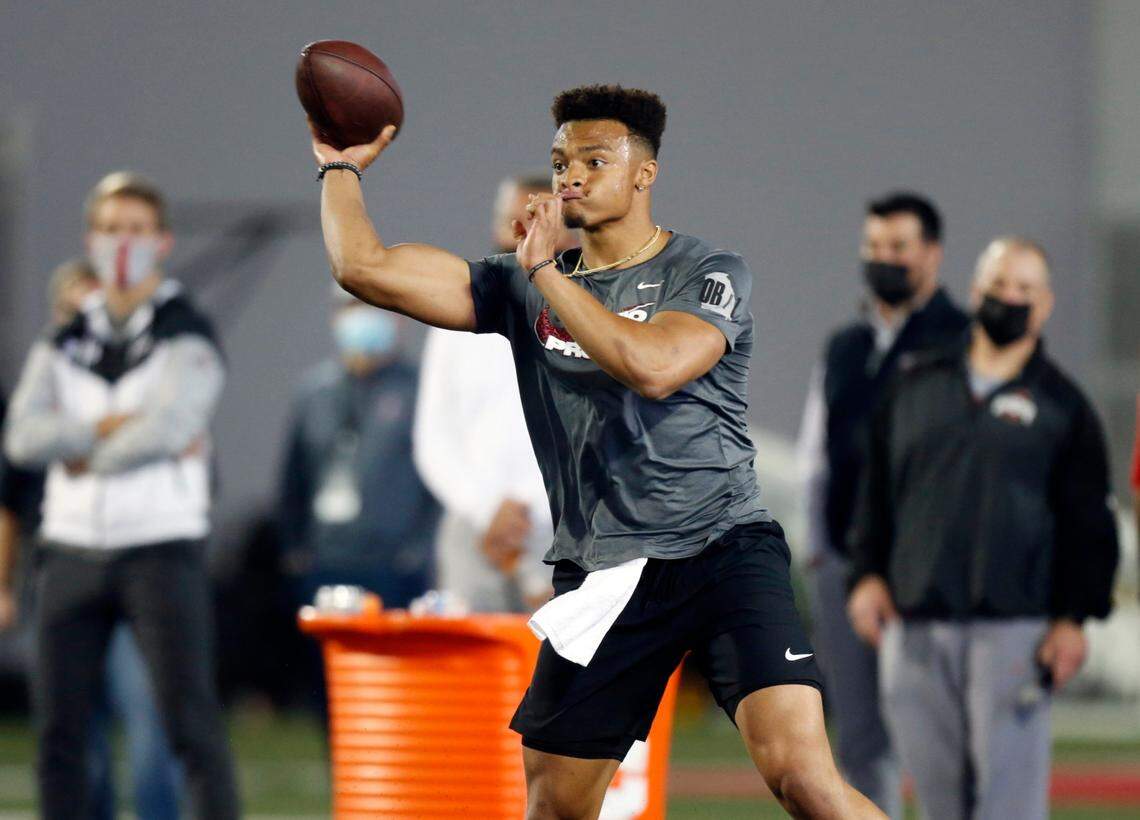 Quarterback Justin Fields throws as part of a drill during an NFL Pro Day at Ohio State University, Tuesday, March 30, 2021, in Columbus, Ohio. (AP Photo/Paul Vernon)