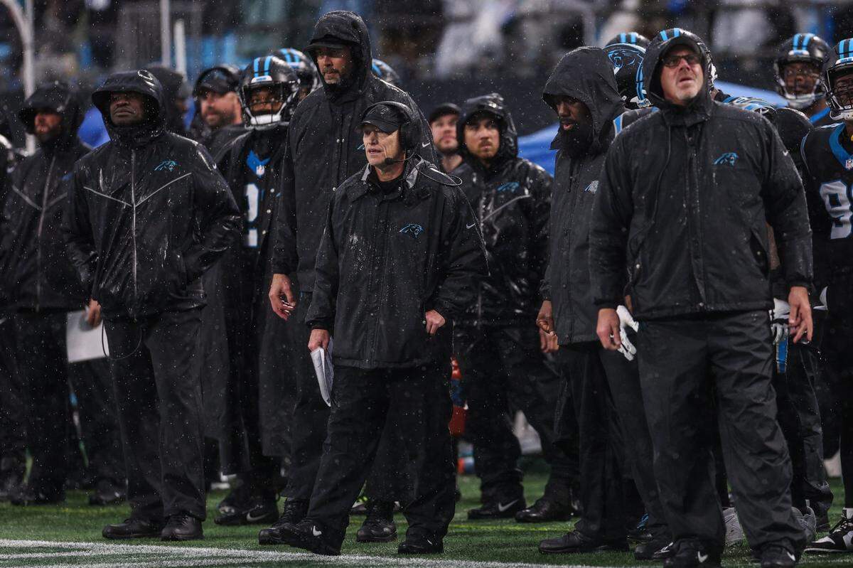 Panthers interim head coach Chris Tabor, center, watches the game from the sideline during eh game against the Falcons at Bank of America Stadium on Sunday, December 16, 2023.