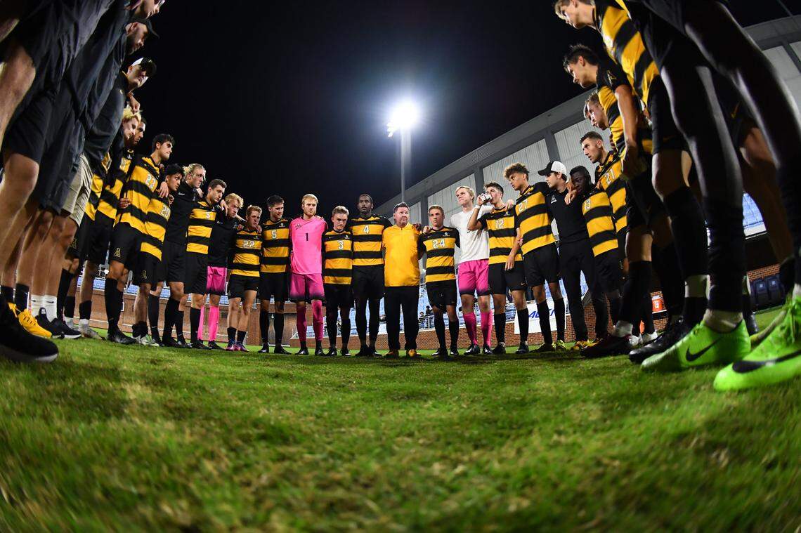 Appalachian State players and coaches huddled before taking on North Carolina in Chapel Hill in 2019. The Mountaineers upset the Tar Heels, 1-0. Appalachian State announced it was disbanding the men’s soccer team as a cost-cutting measure on May 26, 2020.