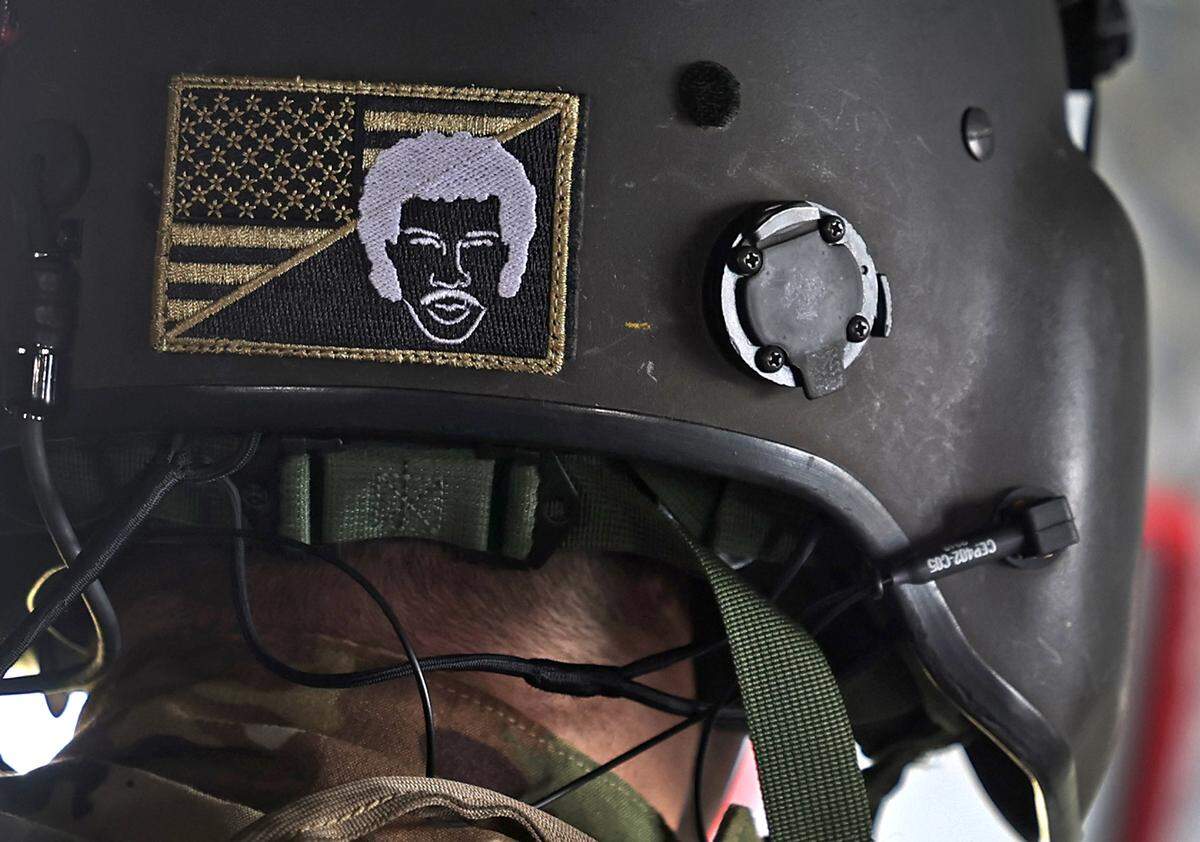 Kelton Buehner, a crew member with Bravo Company 1-171, has a Lionel Richie badge affixed to his helmet. The company has adopted the insignia of Richie as their symbol that the team takes great pride in. The crew spent Thursday, October 3, 2024 delivering pallets of bottled water and ready to eat meals to citizens in the Buladean and Poplar, NC areas. The communities are suffering the effects of Hurricane Helene.