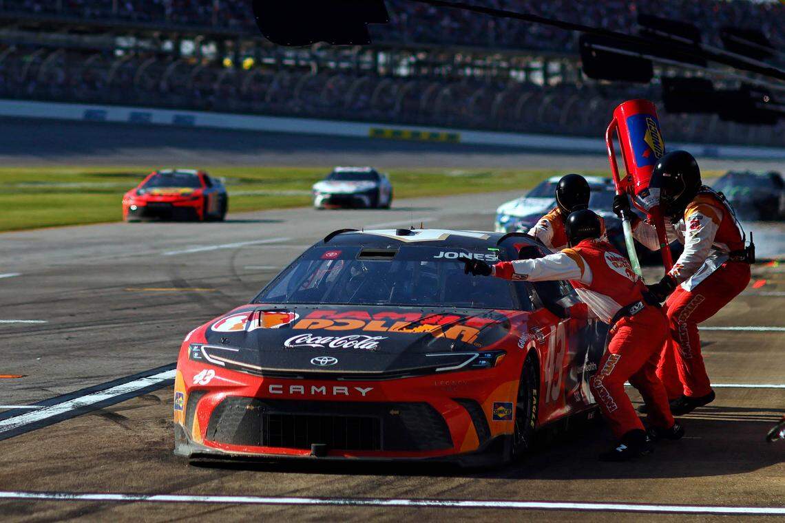 Apr 21, 2024; Talladega, Alabama, USA; NASCAR Cup Series driver Erik Jones (43) makes a pit stop during the GEICO 500 at Talladega Superspeedway.