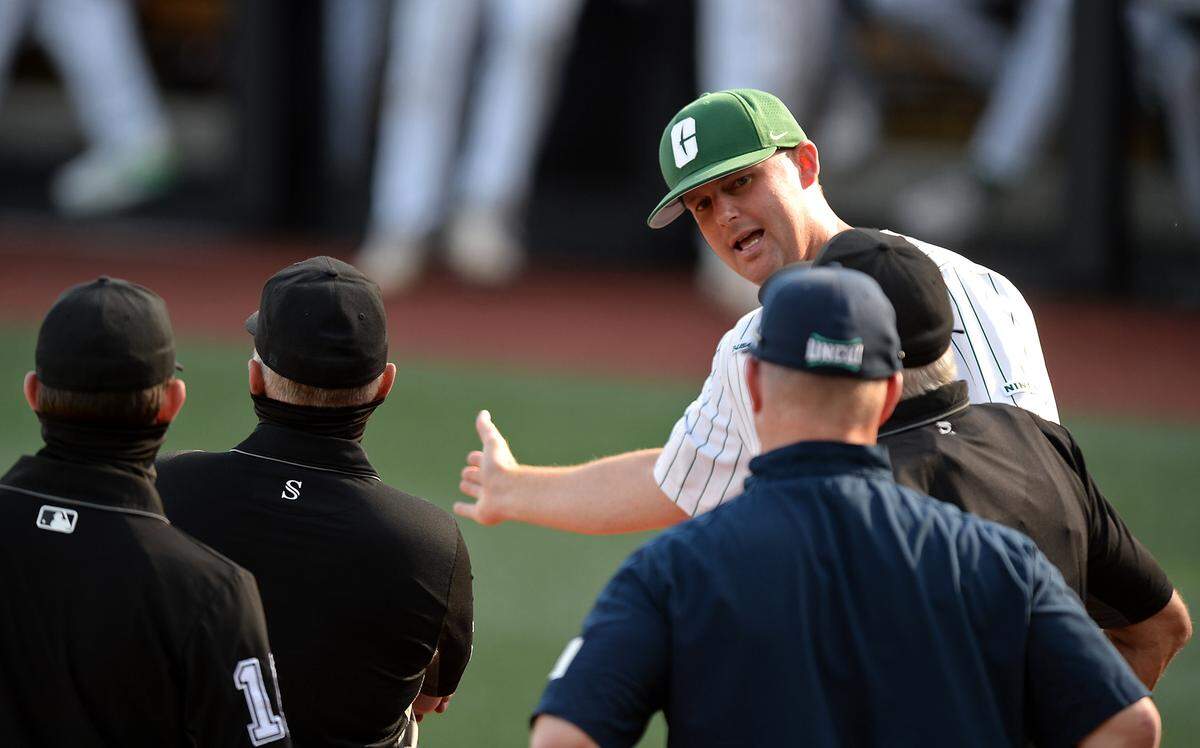 Charlotte 49ers head coach Robert Woodard, right, discusses the nuances of the Robert & Mariam Hayes Stadium field prior to action against UNCW on Thursday, May 20, 2021. The 49ers are having the best season in school history and may host NCAA tournament games.