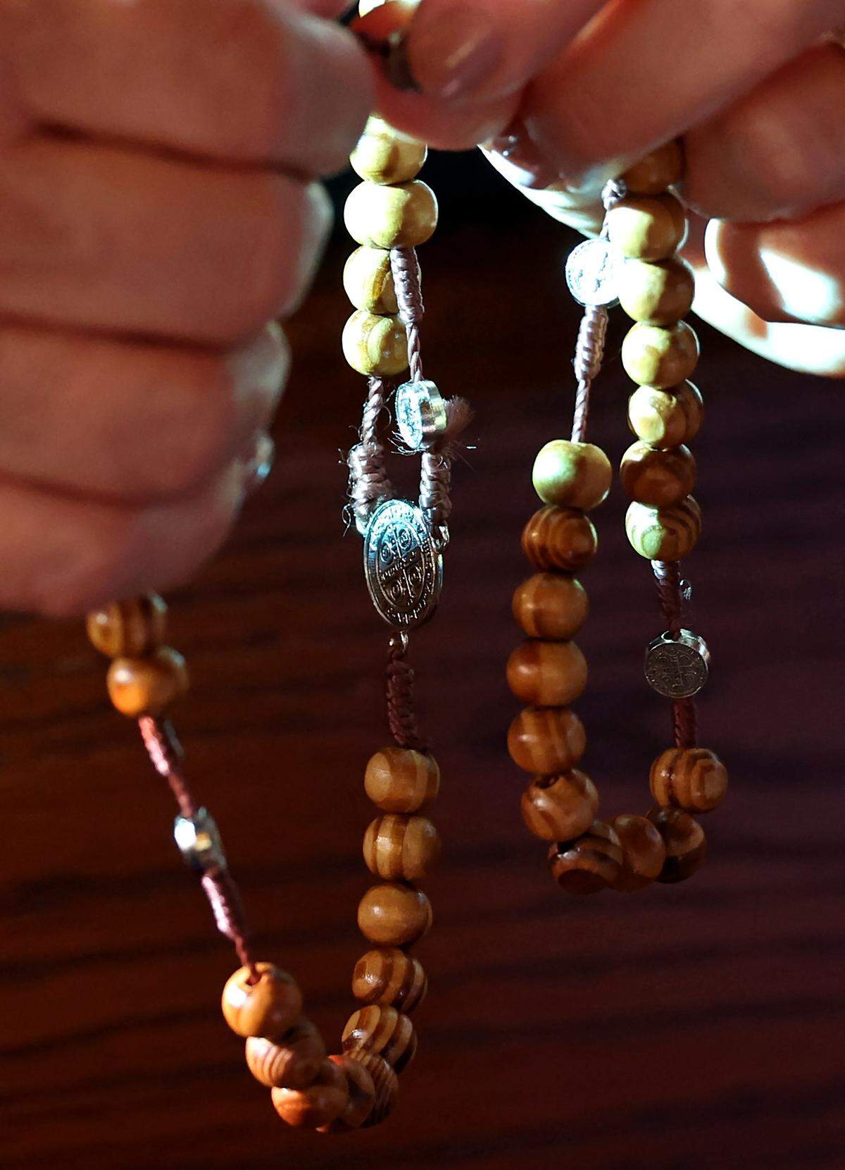 A woman prays the rosary. Some Latino students in Idaho have been punished for wearing rosaries that officials deemed gang-related, according to the ACLU of Idaho. 
