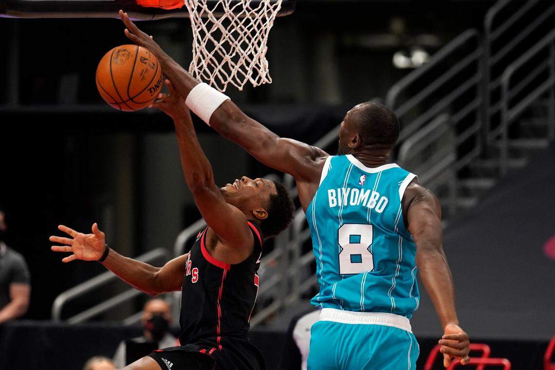 Charlotte Hornets center Bismack Biyombo (8) blocks a shot by Toronto Raptors guard Kyle Lowry (7) during the first half of Saturday’s game in Tampa, Fla.