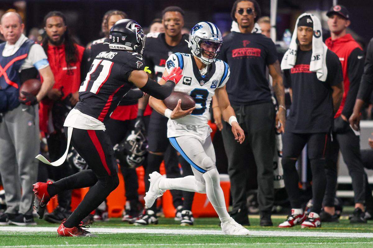 Carolina Panthers quarterback Bryce Young (9) scrambles against the Atlanta Falcons in Sunday’s third quarter at Mercedes-Benz Stadium.