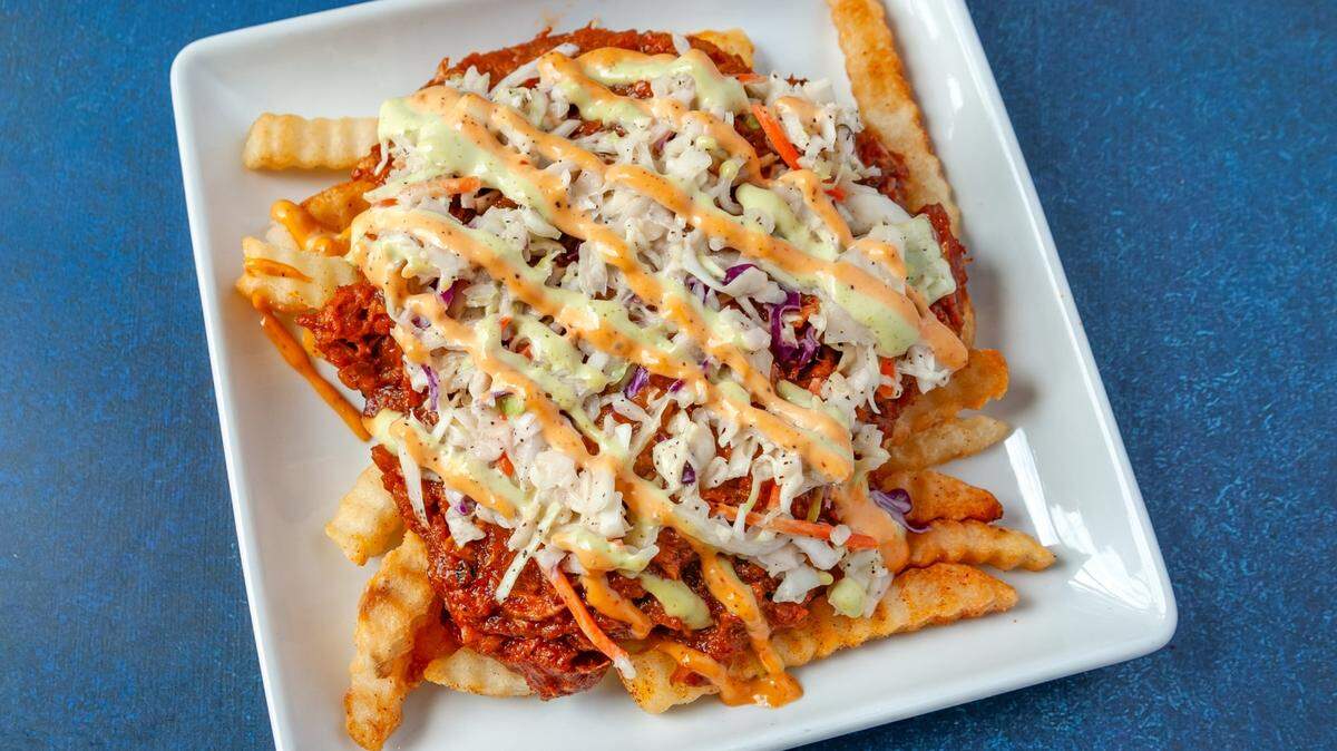 Mike’s Vegan Grill serves its dirty fries with chopped vegan barbecue, coleslaw, pickles and special sauce.
