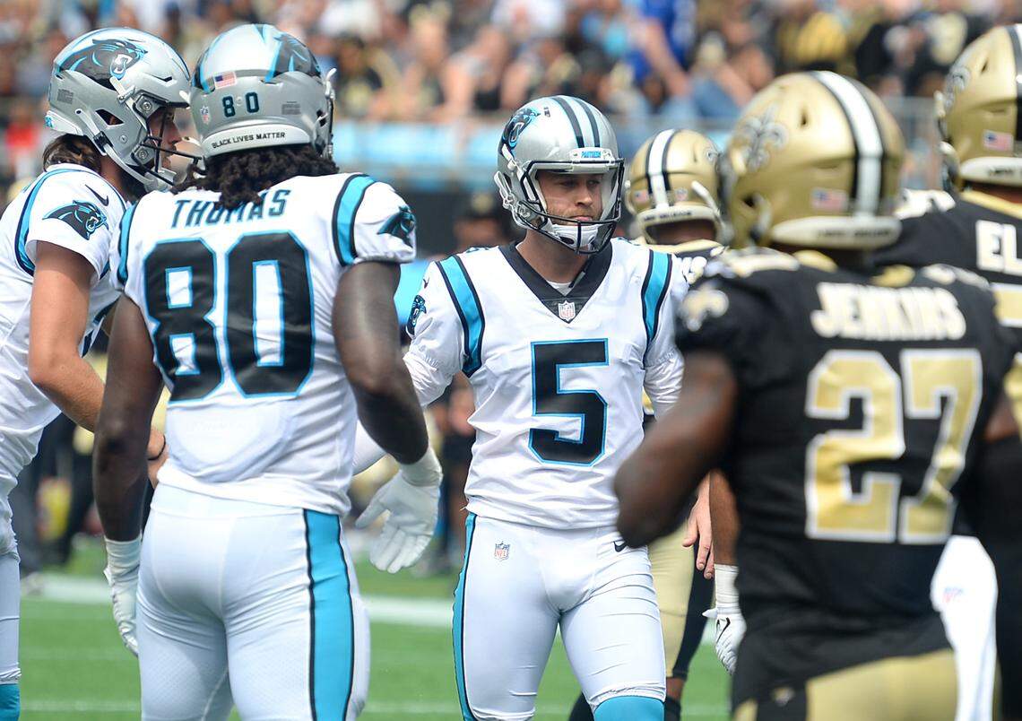 Carolina Panthers kicker Zane Gonzalez, center, is congratulated by his teammates after kicking a field goal against the New Orleans Saints at Bank of America Stadium on Sunday, September 18, 2021. The Panthers defeated the Saints 26-7.