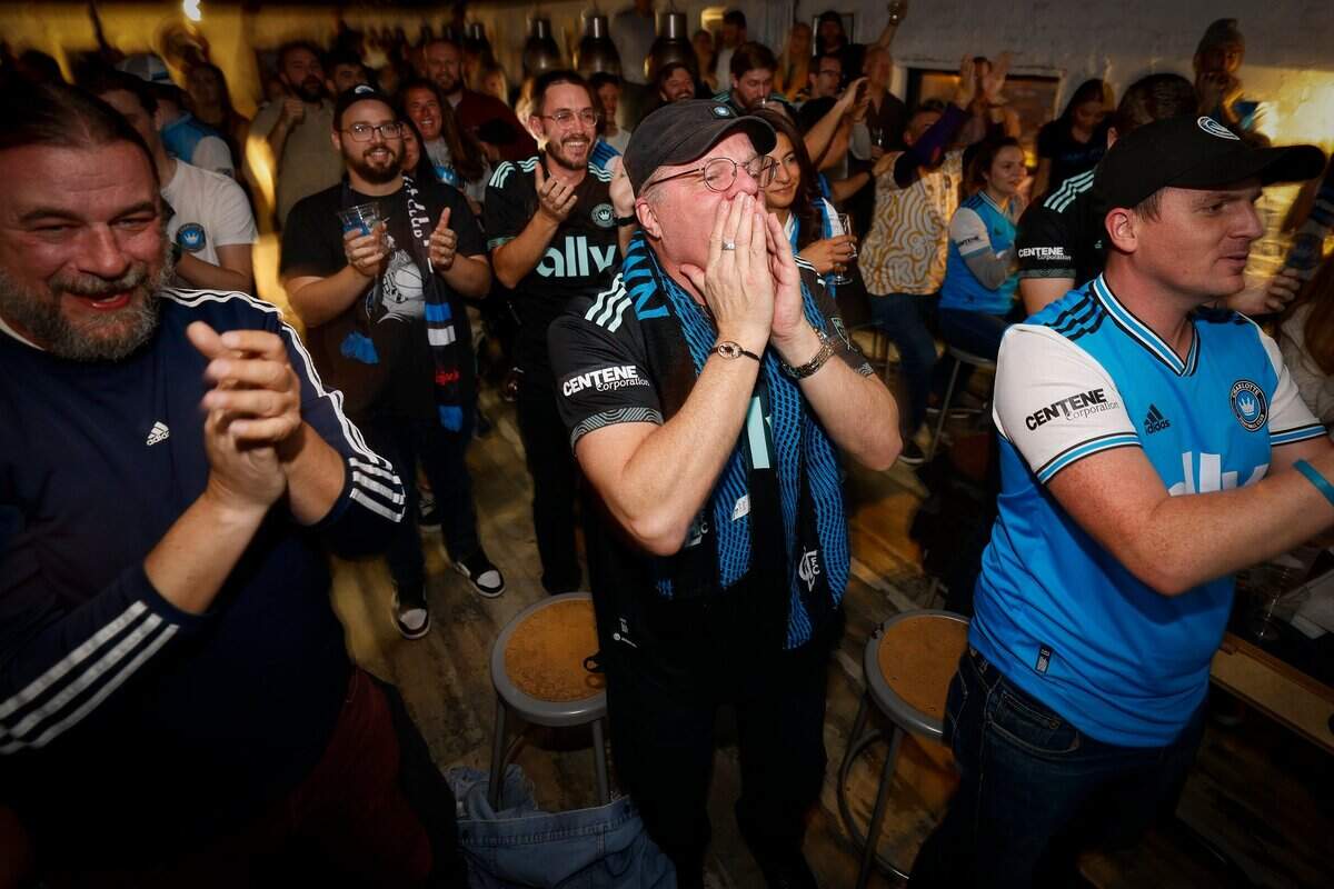 Charlotte FC fans celebrate an apparent goal during a watch party at Salud Beer Shop in Charlotte, Saturday, Feb. 26, 2022. The goal was eventually overturned due to an offsides call, and D.C. United beat Charlotte FC 3-0 in Washington.