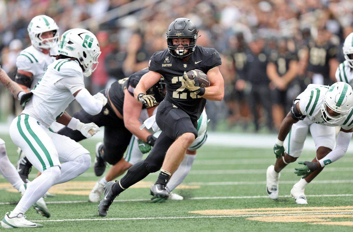 Army Black Knights running back Briggs Bartosh (29) carries the ball against the Charlotte 49ers during Saturday’s first half at Michie Stadium. 