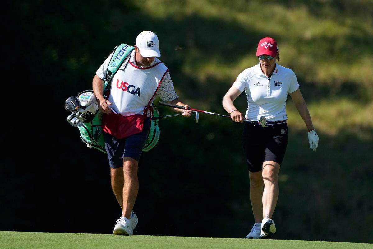 Annika Sorenstam walks up the 11th fairway with her caddie during the first round of the U.S. Women’s Open golf tournament at the Pine Needles Lodge & Golf Club in Southern Pines, N.C. on Thursday.