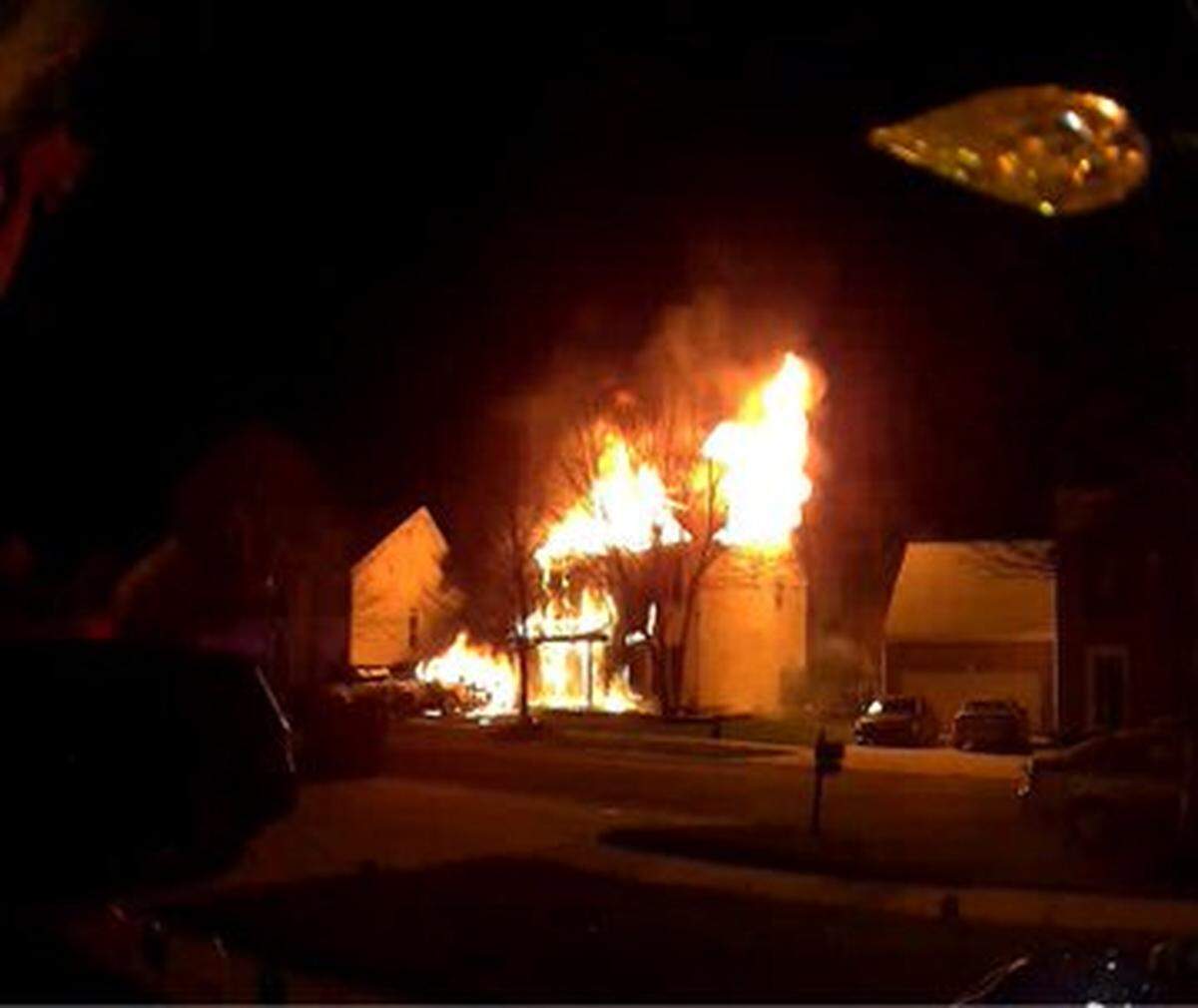A home near Hopewell High School in northwest Mecklenburg County is shown ablaze in this Ring door bell image distributed on Twitter by the Huntersville Fire Department early Wednesday, Jan. 5, 2022.