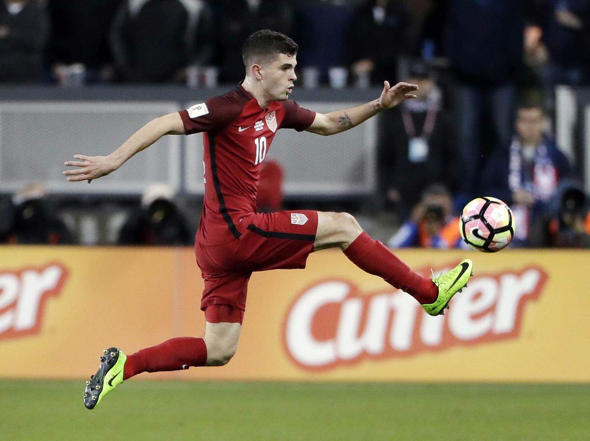 FILE - In this Friday, March 24, 2017, file photo, United States’ Christian Pulisic, right, controls the ball during the first half of a World Cup qualifying soccer match against Honduras in San Jose, Calif. A week after becoming just the seventh American to score in the Champions League, and the youngest,  Pulisic got one goal and set up three others Friday in the United States’ 6-0 rout of Honduras in a critical World Cup qualifier.(AP Photo/Marcio Jose Sanchez, File)