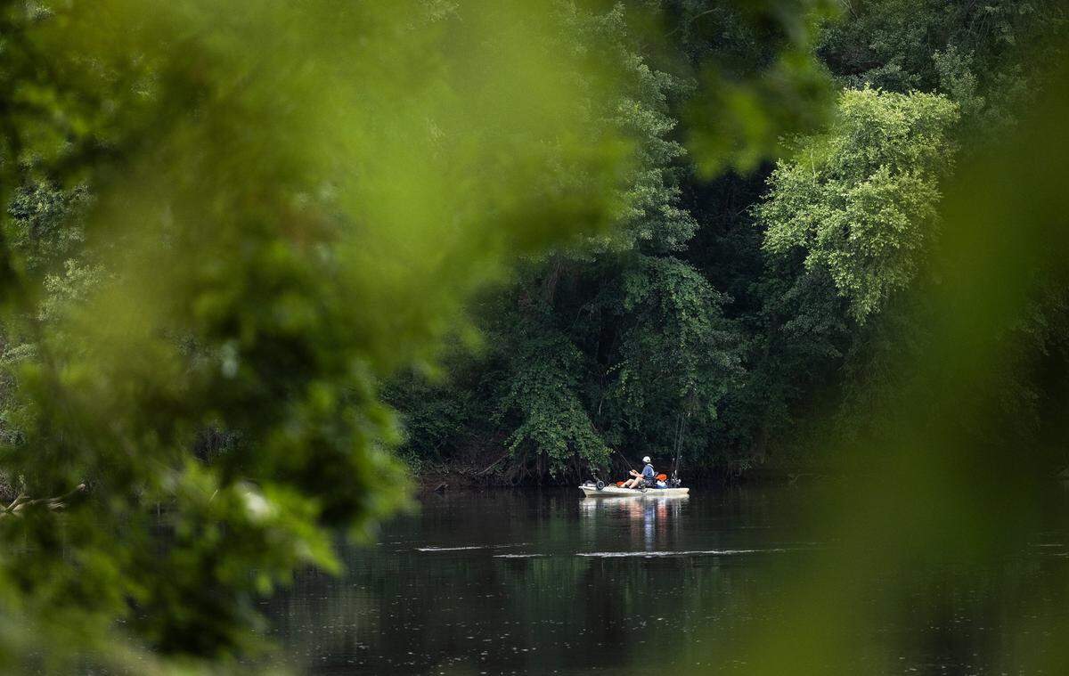 A person rides a boat in Riverwalk Park in Rock Hill, S.C, on Wednesday, June 29, 2022.