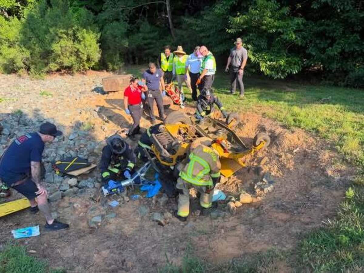 A rider trapped under a large mower in Waxhaw was freed by first responders on Friday.