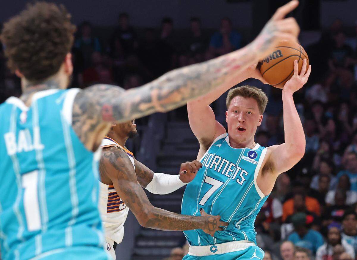 Charlotte Hornets forward Kon Knueppel (right) set the franchise record for most 3-pointers in a season Thursday in the Hornets’ win over Phoenix. With four Thursday, Knueppel now has 261 on the season.