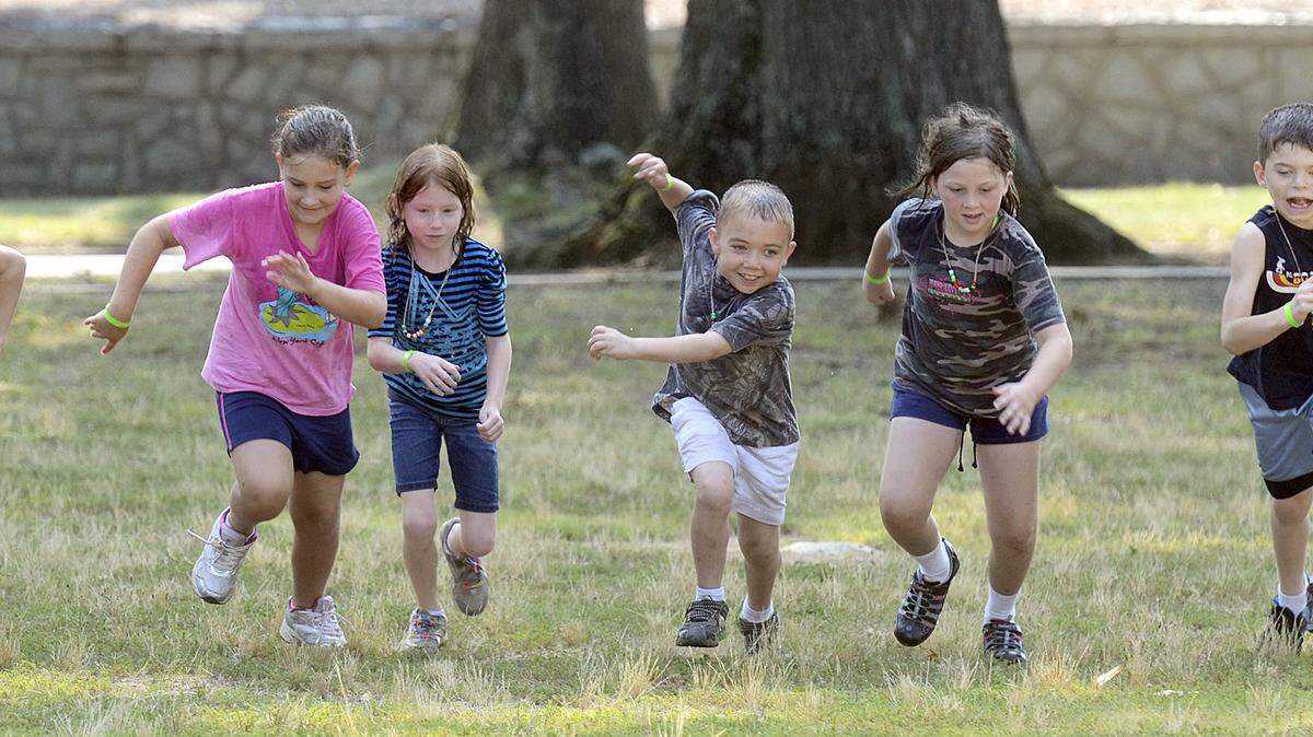 In this 2012 photo, children compete in a relay race.