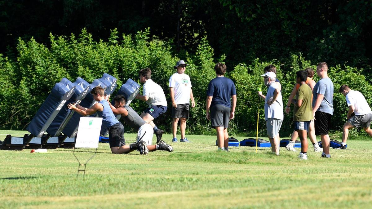 Members of the Weddington High team run a drill during the first day of football practice at the school on Monday, July 6, 2020. Union County high school football workouts started on Monday due to COVID-19.