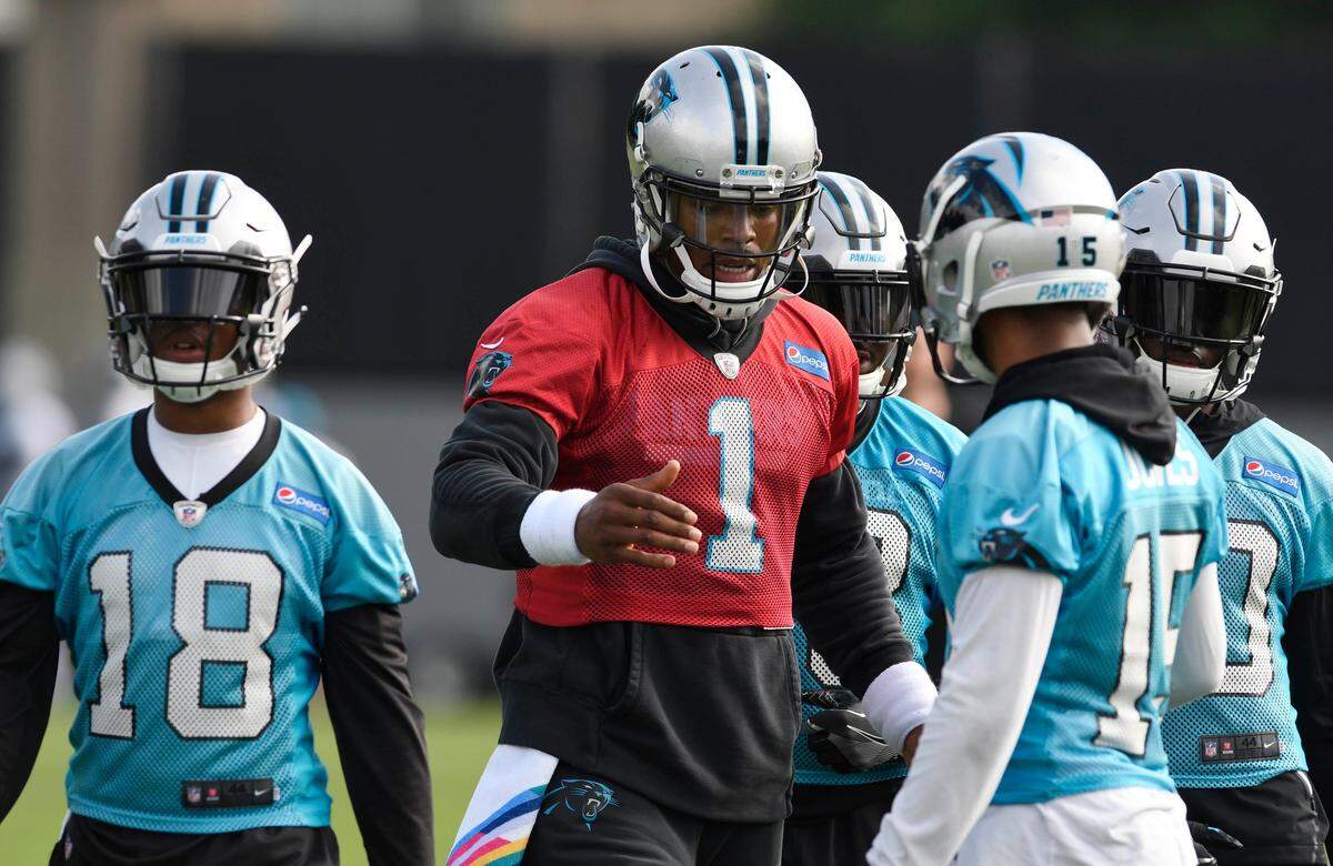Carolina Panthers quarterback Cam Newton (1) is able to build a rhythm with his receivers much earlier this spring than last year, when he was rehabilitating a surgically repaired shoulder through the preseason.