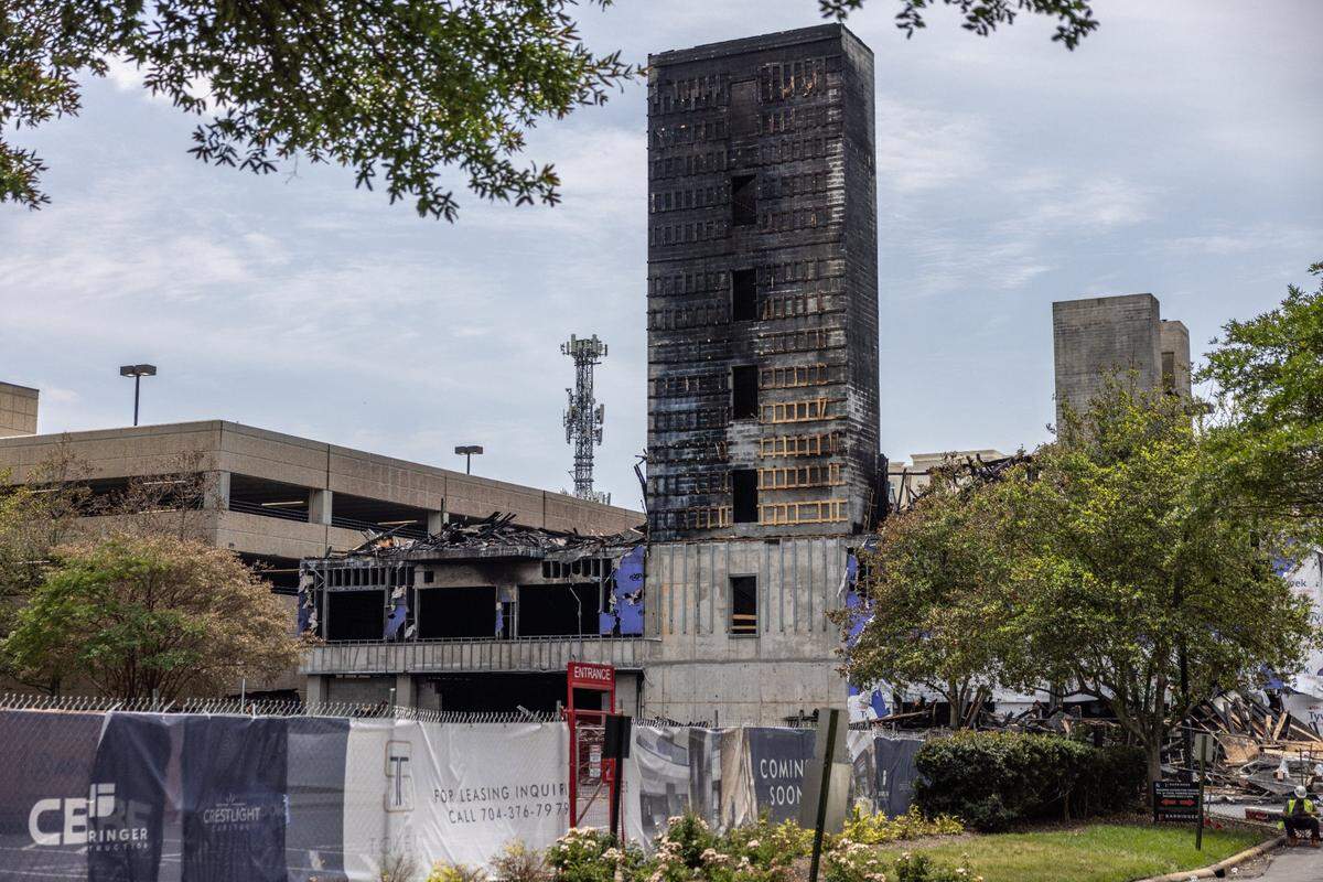 After the five-alarm fire at a large apartment building near SouthPark Mall on May 18, little was left of the building site but the bottom floors, the elevator shafts and charred rubble.