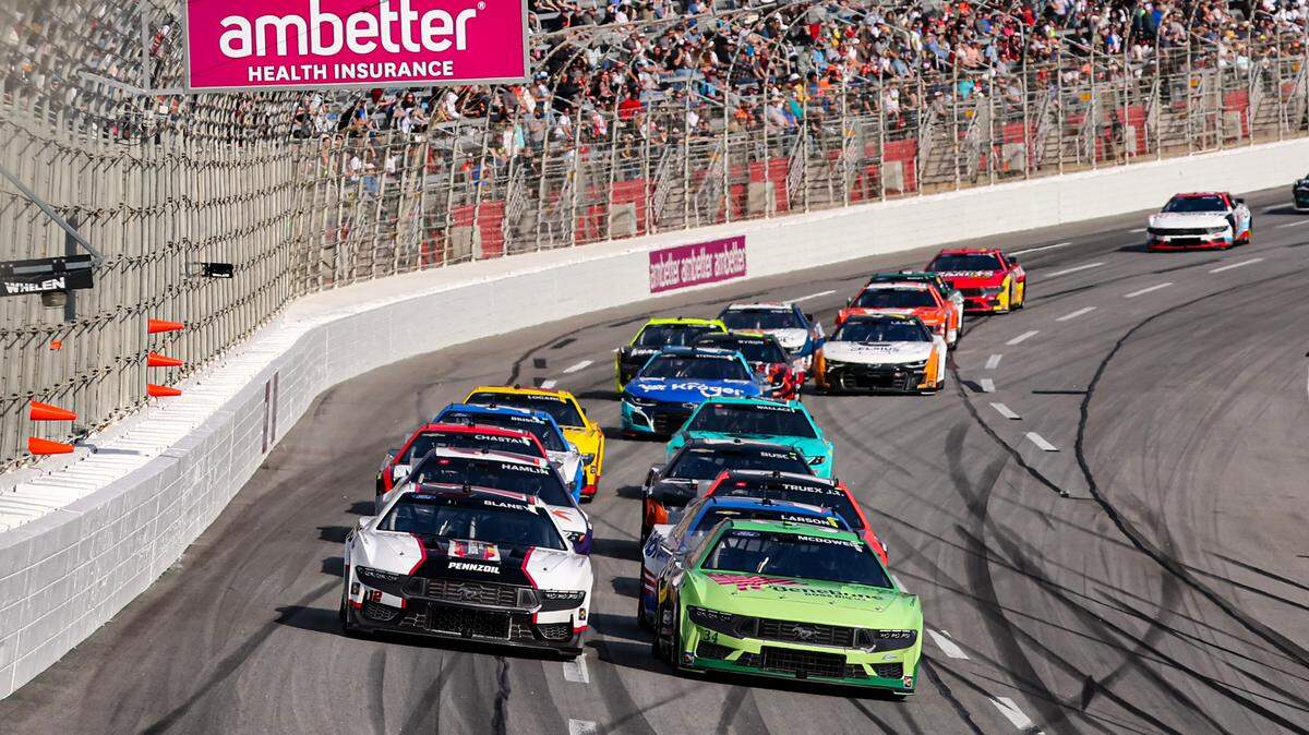 Feb 25, 2024; Hampton, Georgia, USA; NASCAR Cup Series driver Michael McDowell (34) battles with NASCAR Cup Series driver Ryan Blaney (12) during the Ambetter Health 400 at Atlanta Motor Speedway.