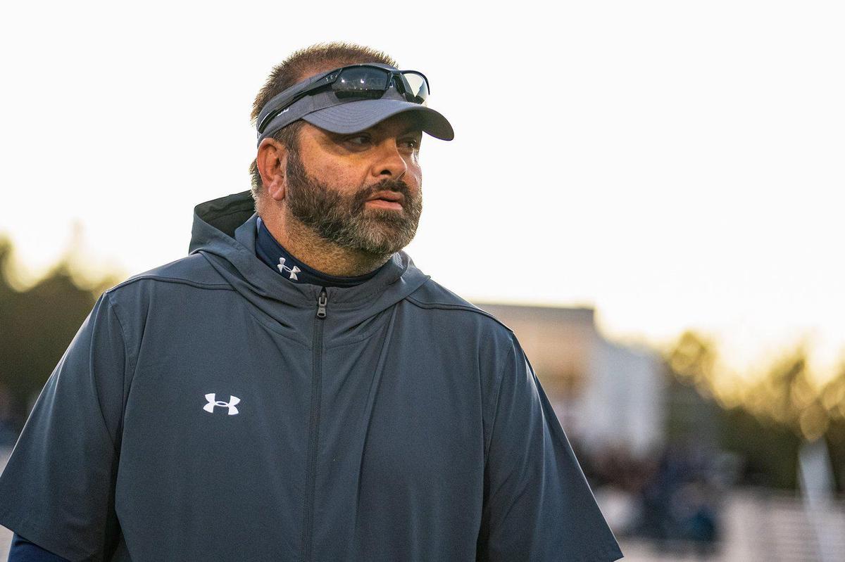 Mallard Creek head coach Mike Palmieri looks over this team as they prepare to take on the Hough Huskies.