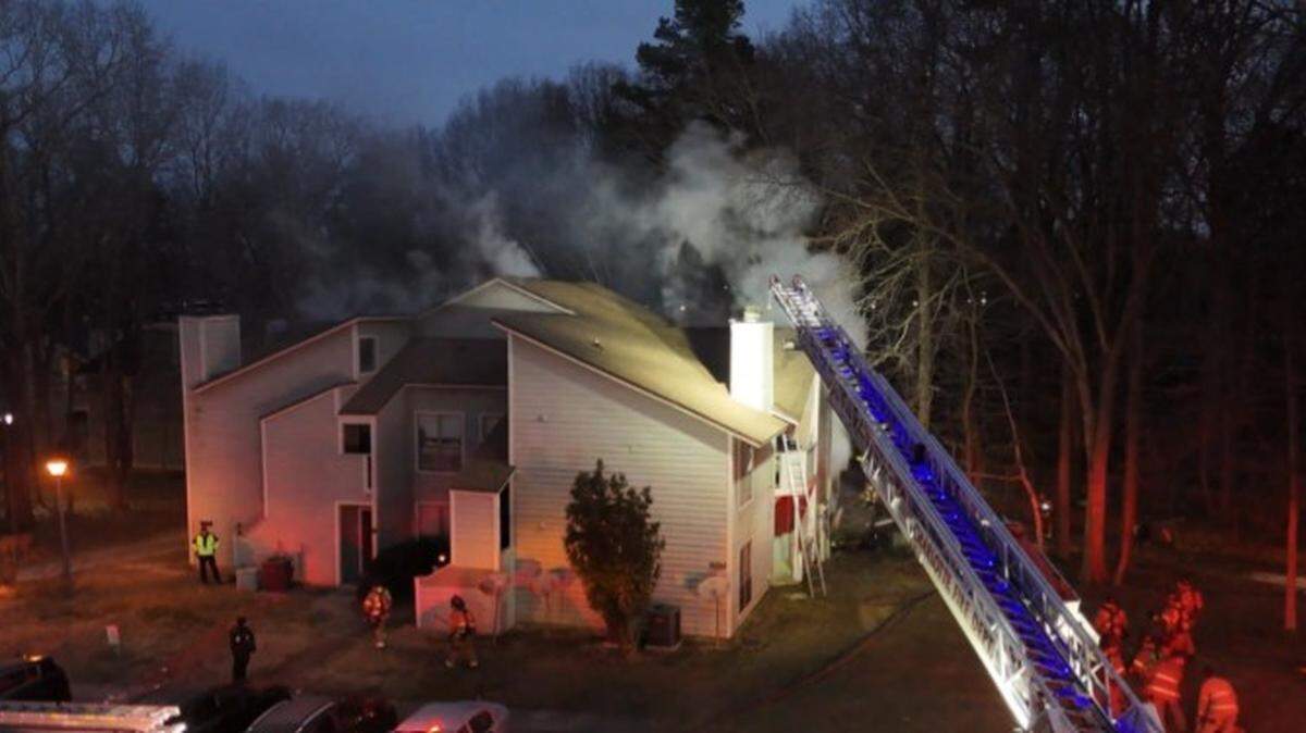 Smoke billows from a fire in a Charlotte apartment building on Wednesday, Jan. 28, 2026. A person found dead had died before the fire broke out, firefighters said.