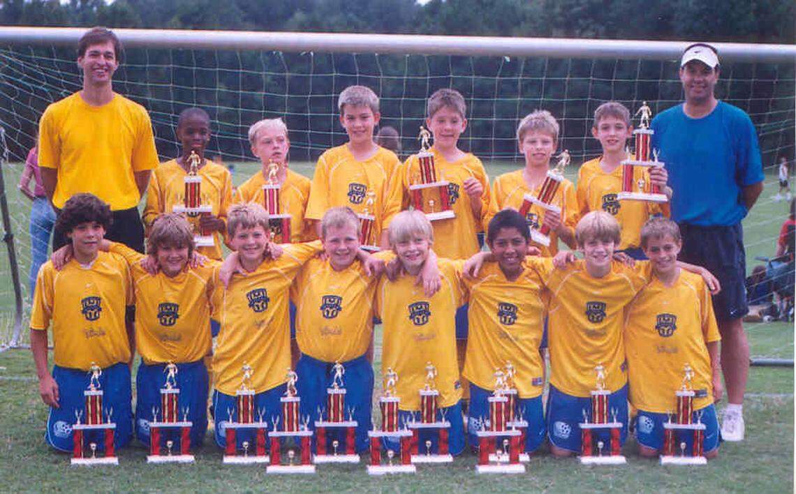 As a boy, Matt Pacifici (fourth from left) played on championship teams coached by his father, Dino (far right).