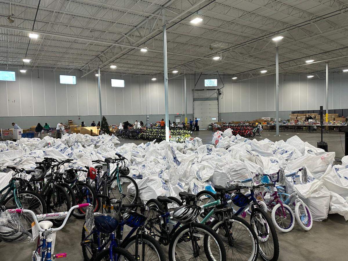 Bags with Christmas gifts for families throughout Charlotte.