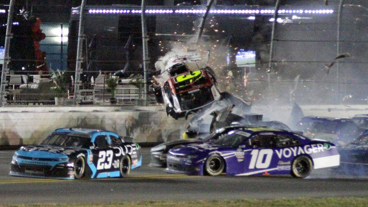 Myatt Snider goes airborne as he crashes on the final lap during the NASCAR Xfinity Series auto race Saturday, Feb. 19, 2022, at Daytona International Speedway in Daytona Beach, Fla. (AP Photo/Chuck McQuinn)