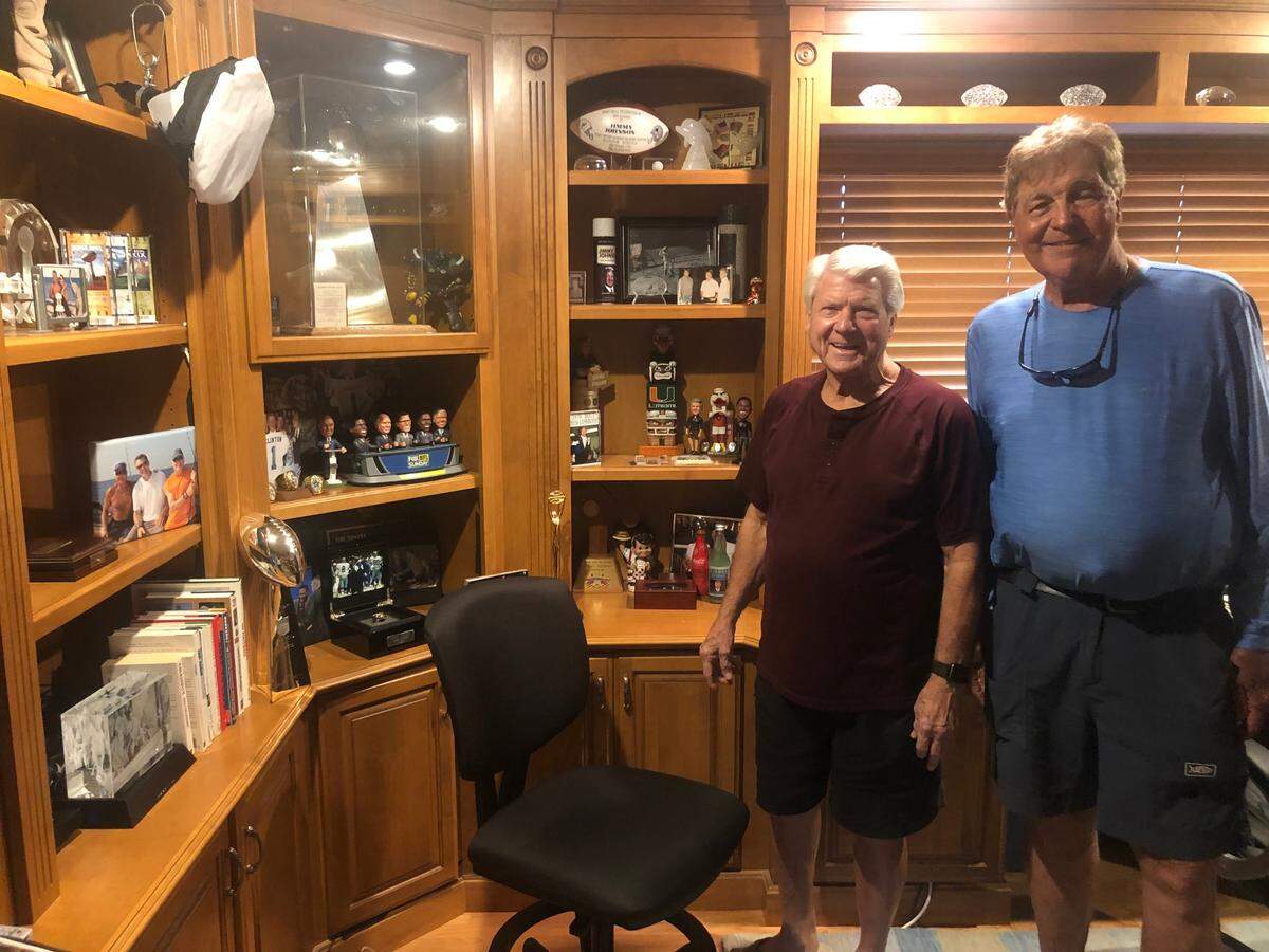 Gus Gustafson, right, with legendary football coach Jimmy Johnson at his home in the Florida Keys.