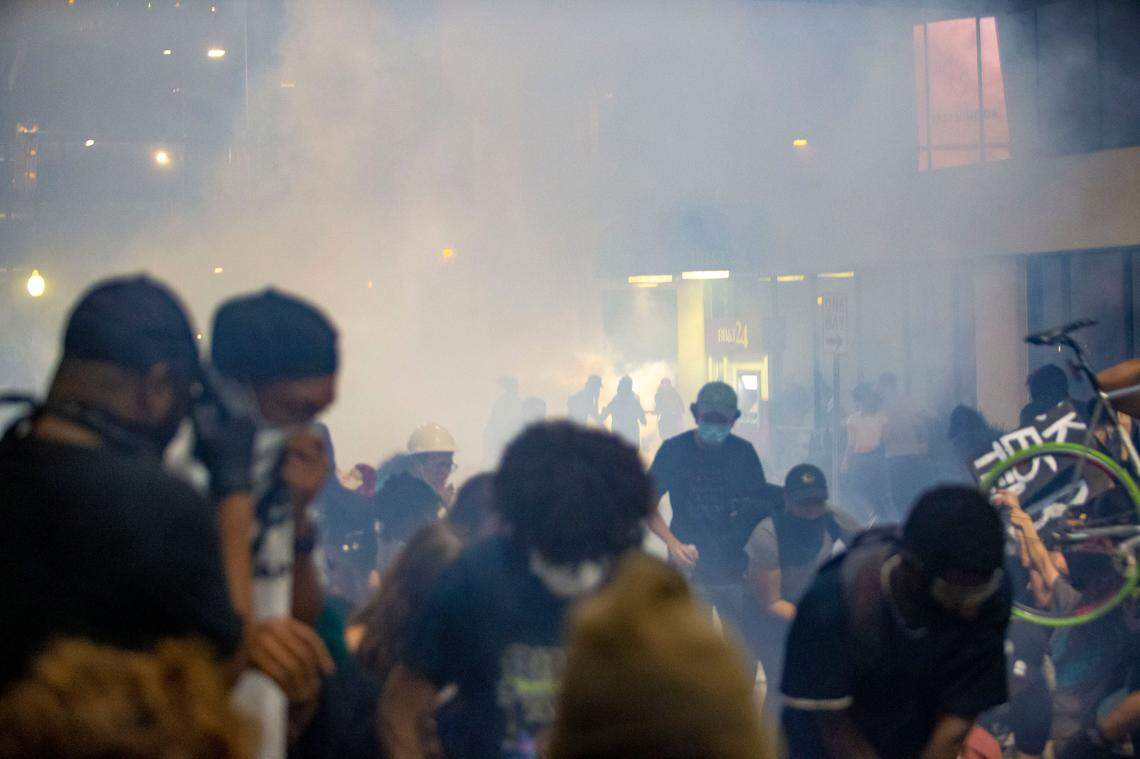 Tear gas clouds envelops protesters who said they were trapped on 4th Street by police, who unleased a barrage of chemical agents.