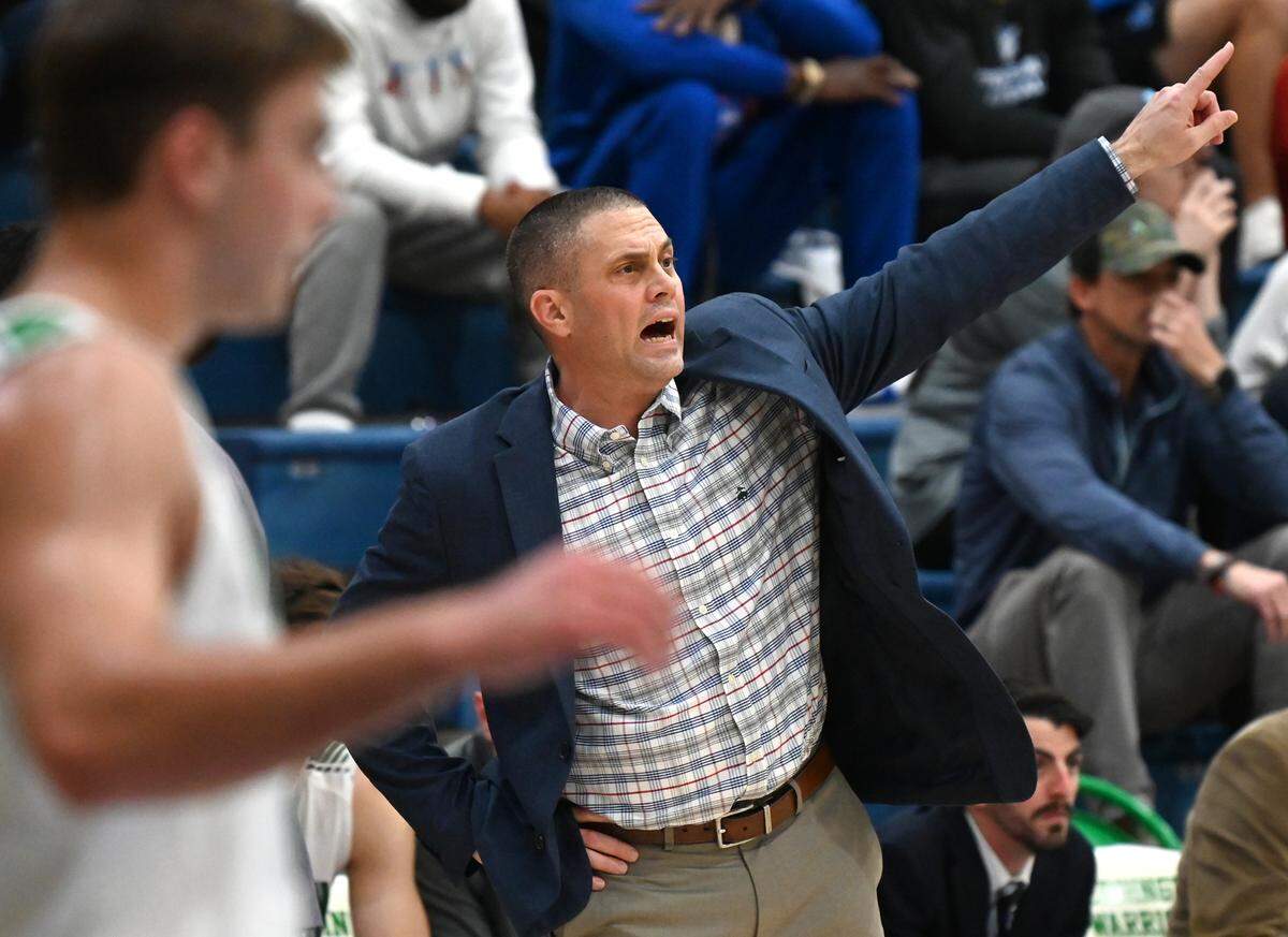 Weddington High head basketball coach Gary Ellington yells instructions to his team during fourth quarter action against Mooresville on Thursday, February 24, 2022. Weddington is top a top 25 nationally ranked team.