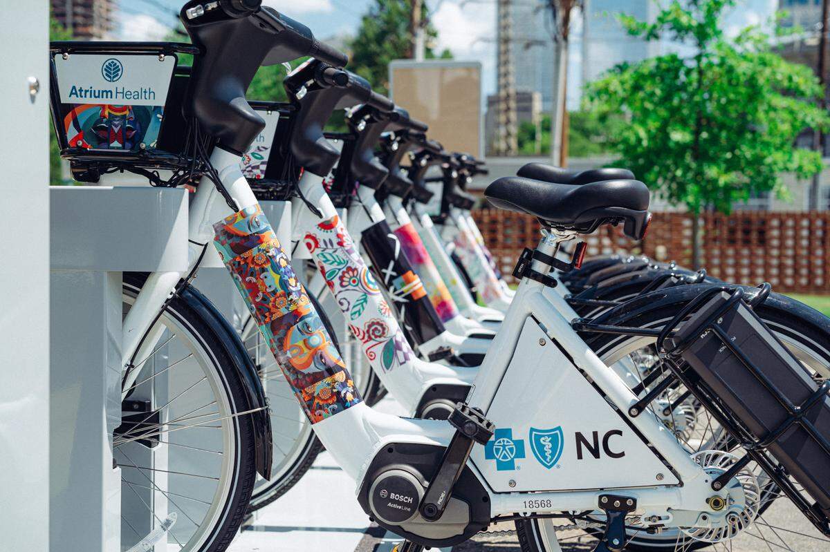 Charlotte Joy Rides, Atrium Health, Blue Cross of North Carolina and Charlotte City Center Partners worked together to commission seven local artists to design the fleet of 250 e-assist bikes.