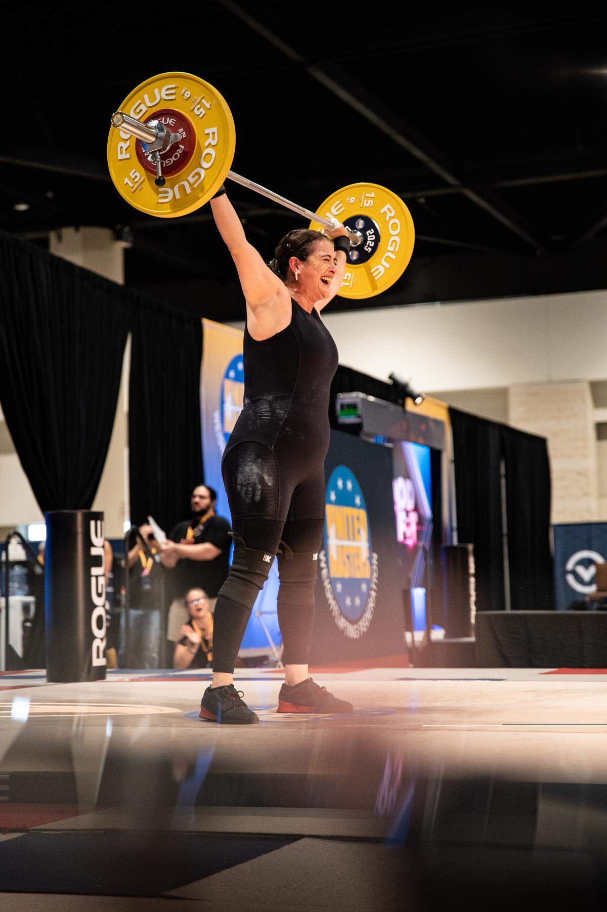 Melissa Melvin-Rodriguez reacts to successfully making her second snatch at 55 kilos as she competes at United Masters Weightlifting Federation (UMWF) World Championships in Daytona Beach, FL on Friday, December 5, 2025.