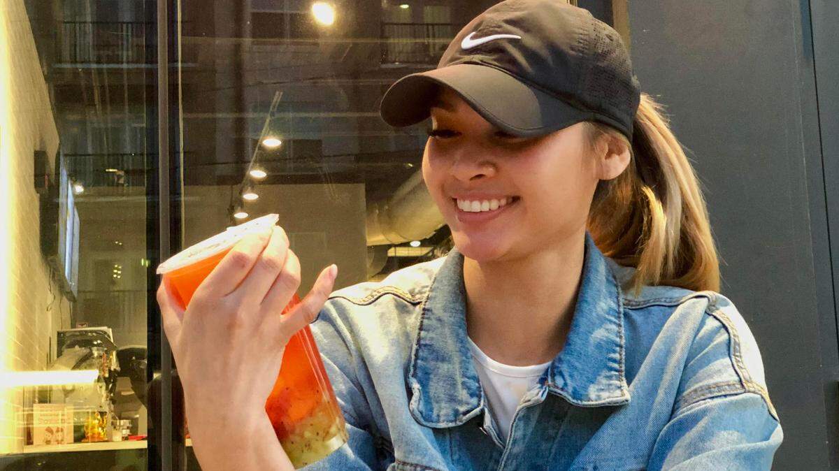 Sharetea Charlotte owner Michelle Tran sips a Strawberry Kiwi Tea with Aiyu Jelly off the secret menu.