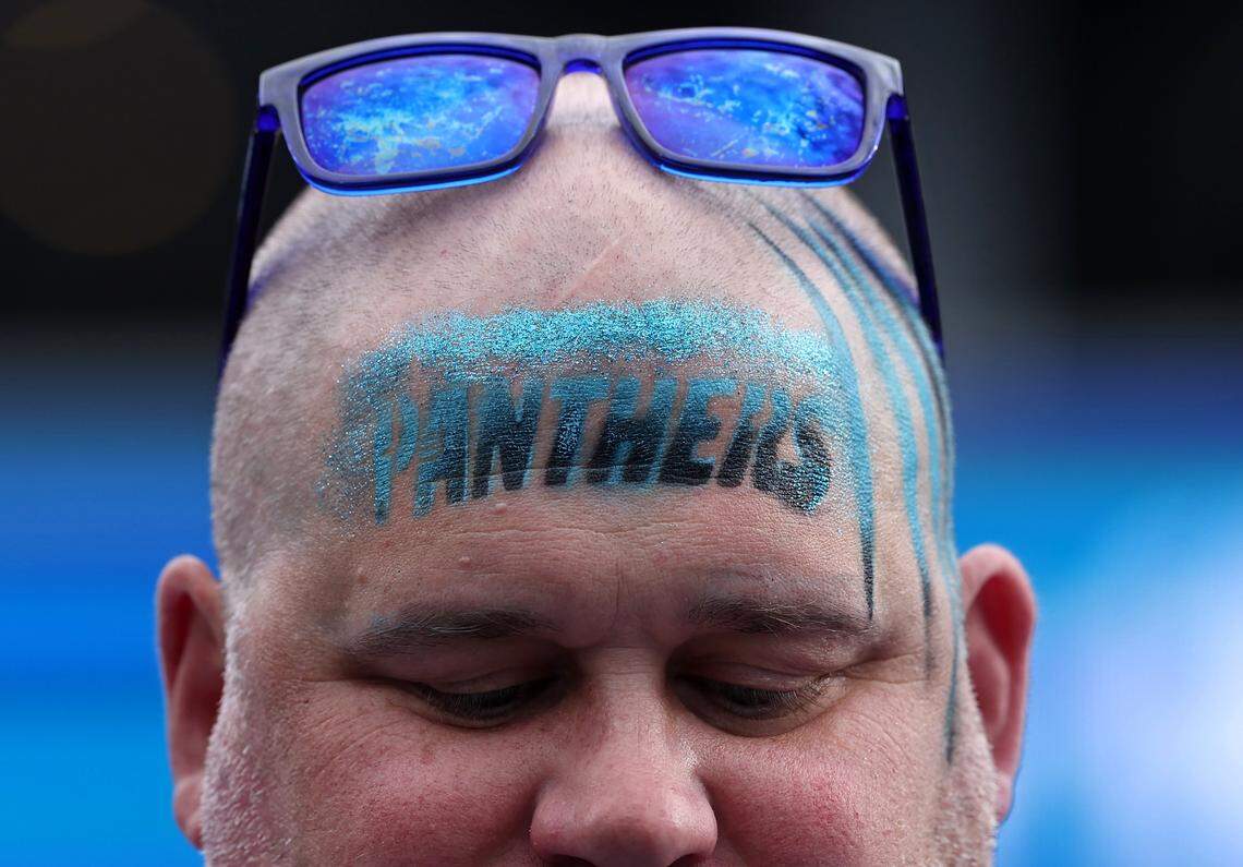 A Carolina Panthers fan shows his support for the team by having the team name airbrushed on his forehead for the team’s matchup against the Tampa Bay Buccaneers on Sunday at Bank of America Stadium in Charlotte. The Panthers defeated the Buccaneers 23-20.