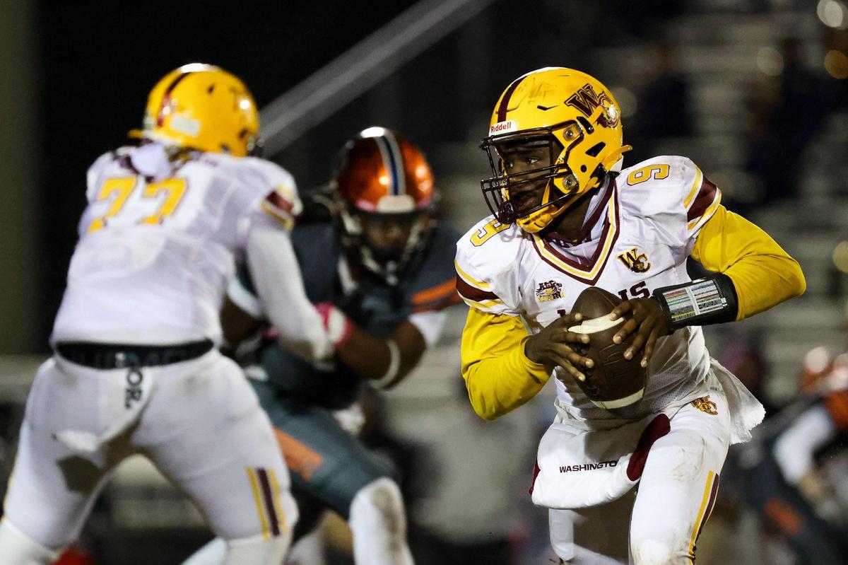 West Charlotte’s KD Smith (9) runs the ball against Chambers during the second quarter 4at Chambers High School on October 20, 2023.