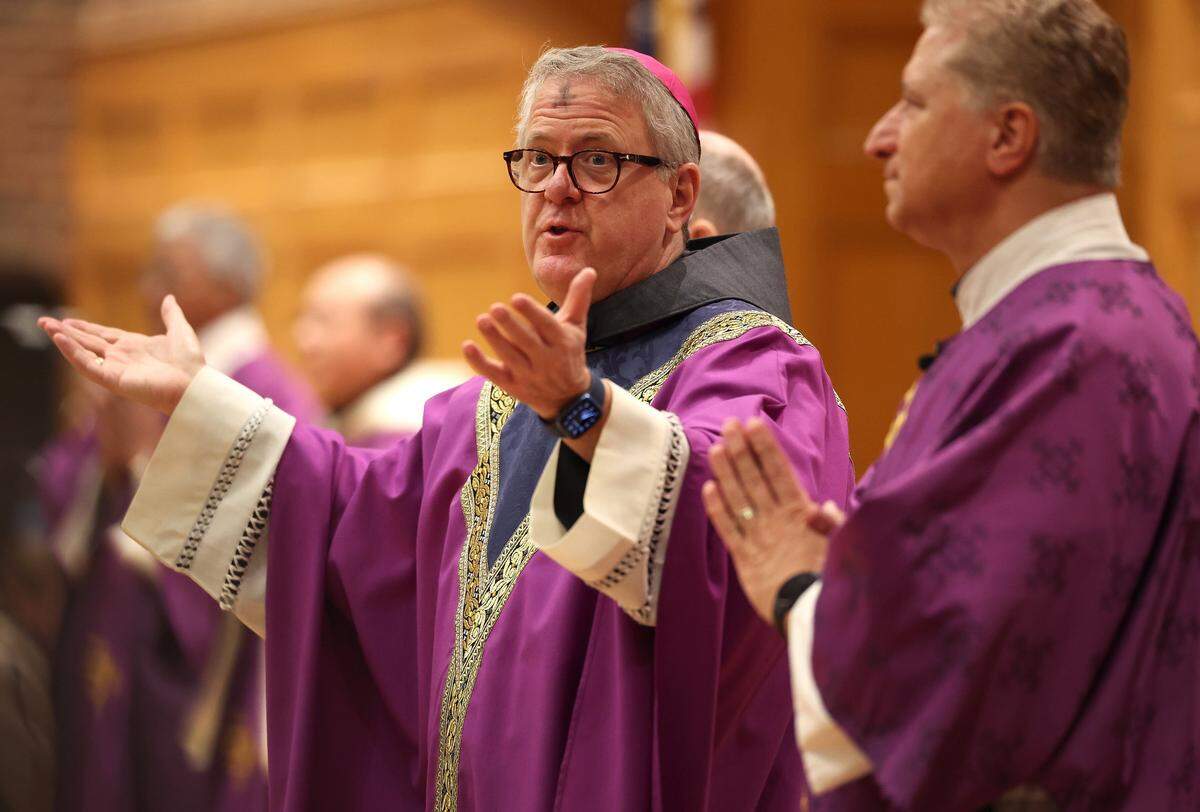 Bishop Michael Martin speaks to parishioners during a Mass at St. John Neumann Catholic Church in Charlotte, NC on Wednesday, February 18, 2026. Bishop Martin is laying out his vision for the church and some of his initial actions have faced scrutiny. 