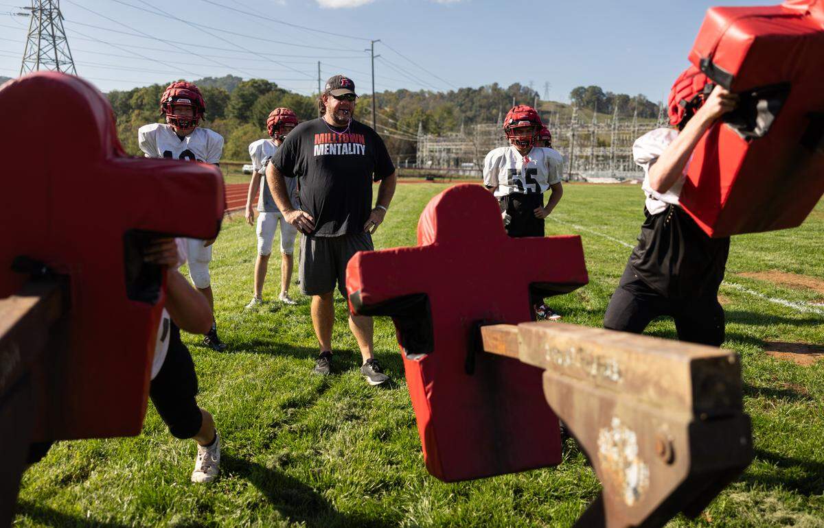 Jody Mathis coaches football on the practice field at Pisgah High School in Canton, N.C., on Tuesday, October 8, 2024.