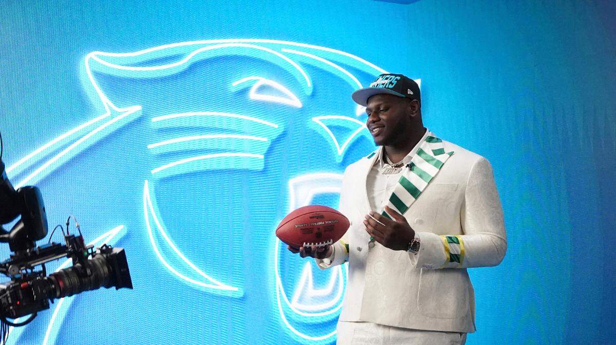 North Carolina State offensive tackle Ikem Ekwonu poses in the media room after he was chosen by the Carolina Panthers with the 6nd pick during the 2022 NFL Draft, Thursday, April 28, 2022, in Las Vegas. (AP Photo/Doug Benc)