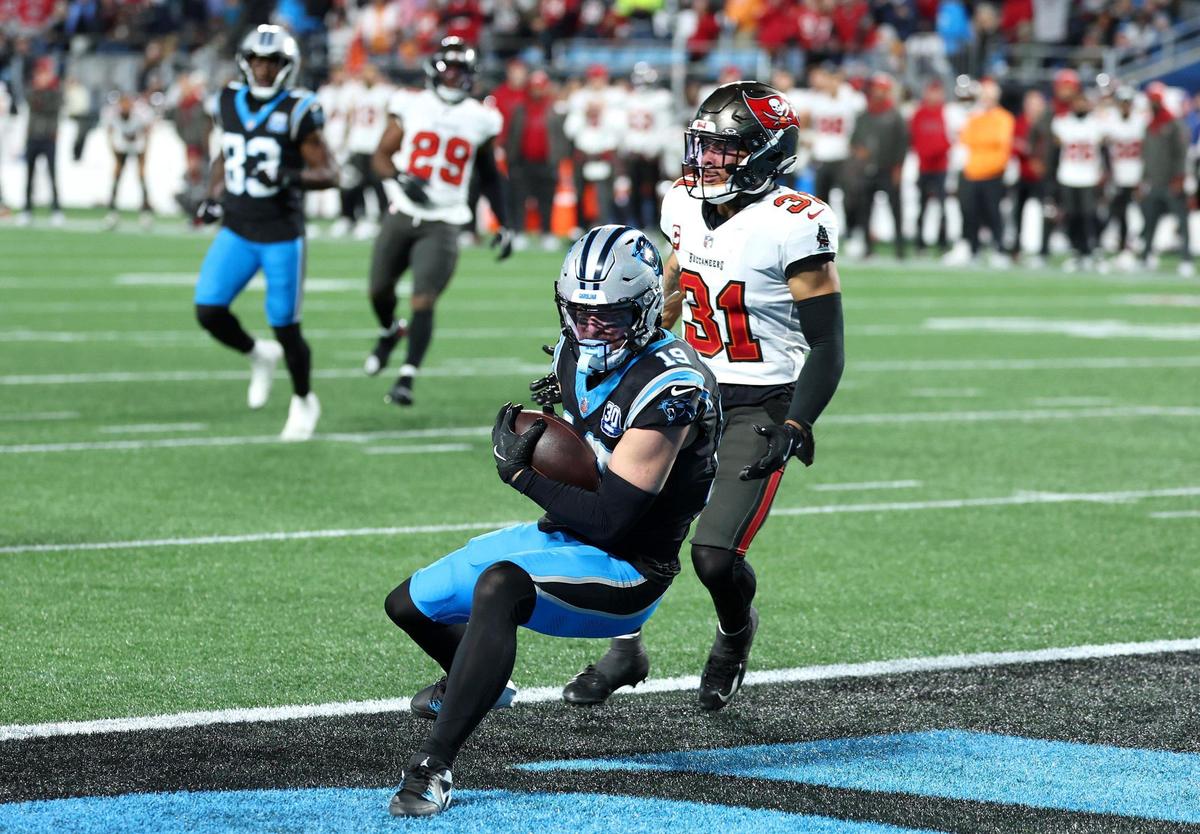 Carolina Panthers wide receiver Adam Thielen catches a touchdown pass from quarterback Bryce Young during action against the Tampa Bay Buccaneers at Bank of America Stadium in Charlotte, NC on Sunday, December 1, 2024. The Buccaneers would defeat the Panthers in overtime 26-23.