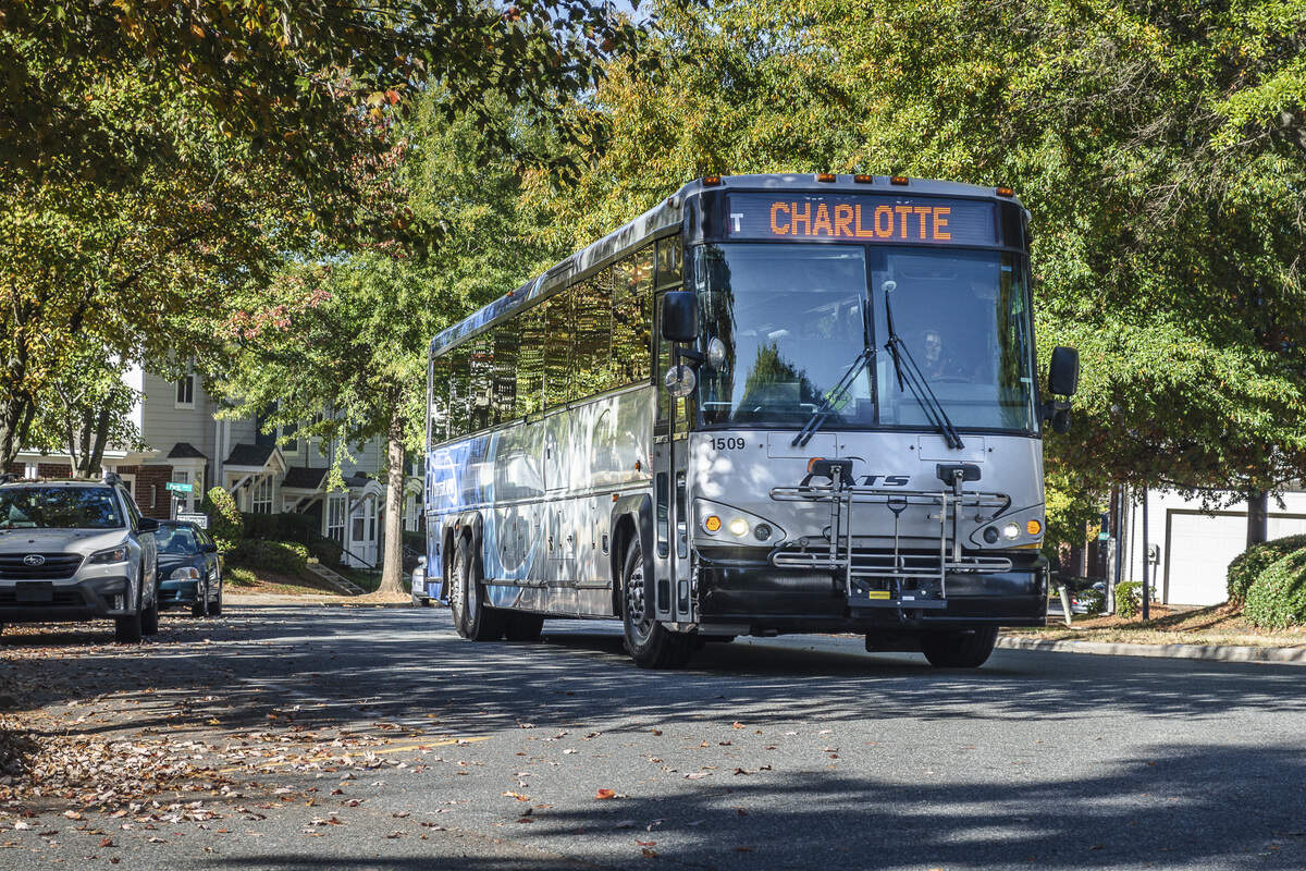 A CATS express bus travels a Charlotte street.