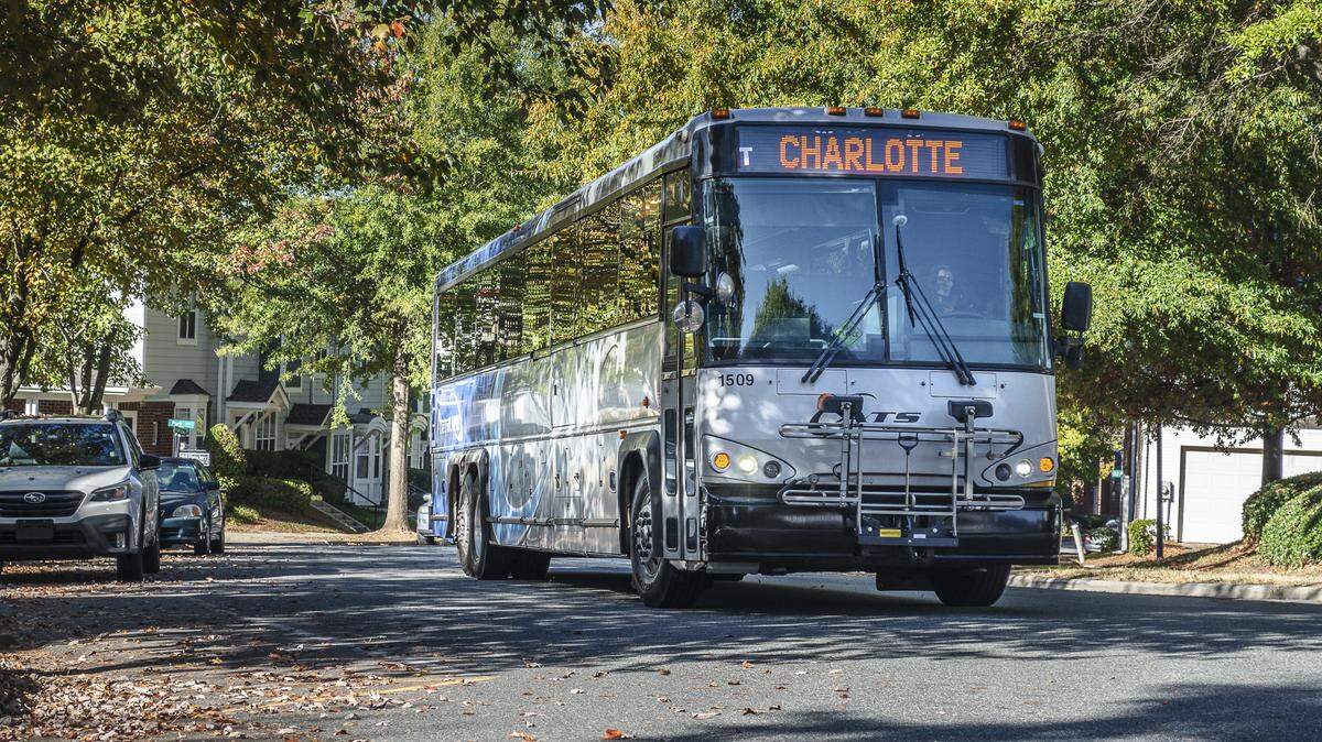 A CATS express bus travels a Charlotte street.