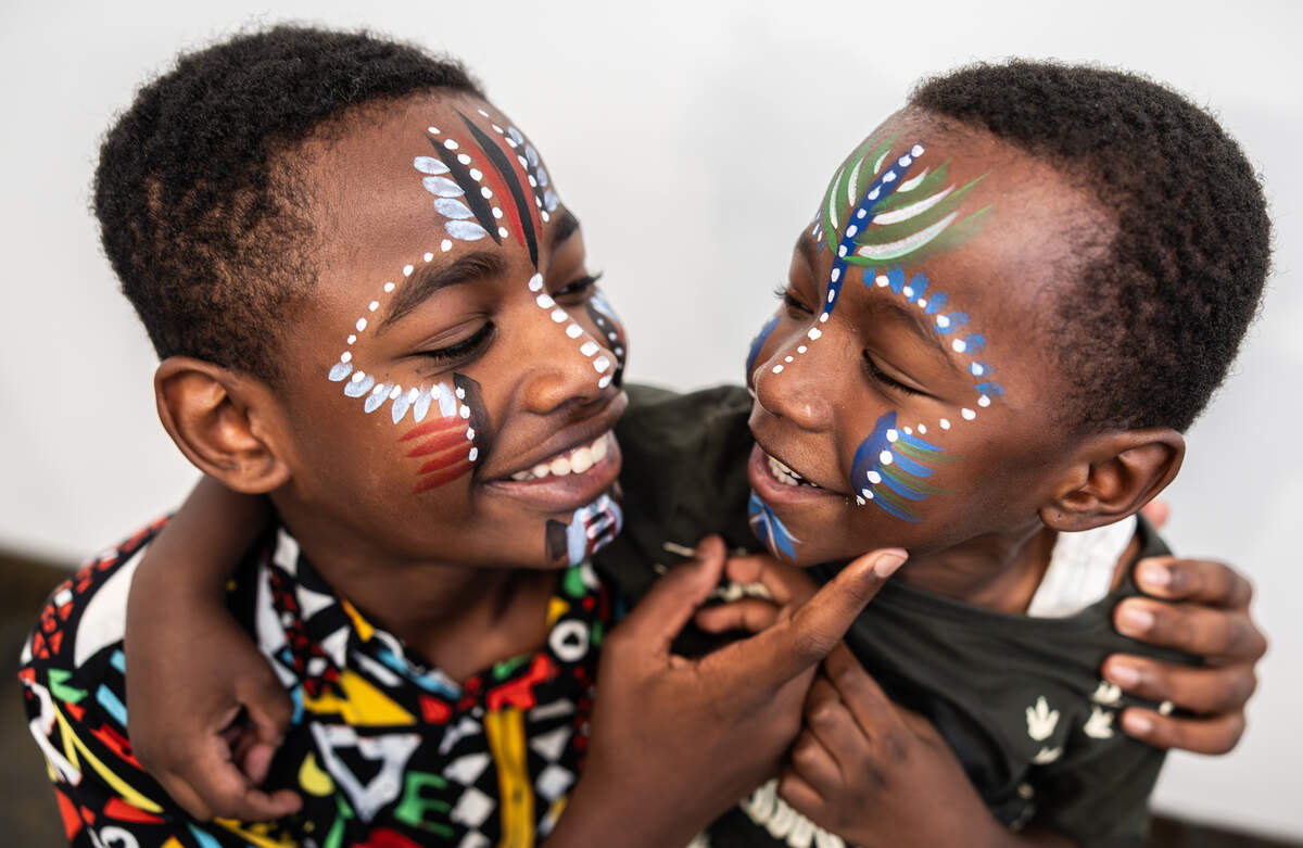 Mason Gabriels, 12, left, and his brother, Matthew, 5, admire each other’s facepaint during Juneteenth at The Gantt at Harvey B. Gantt Center for African-American Arts + Culture in Charlotte, North Carolina, on Friday, June 19, 2026.