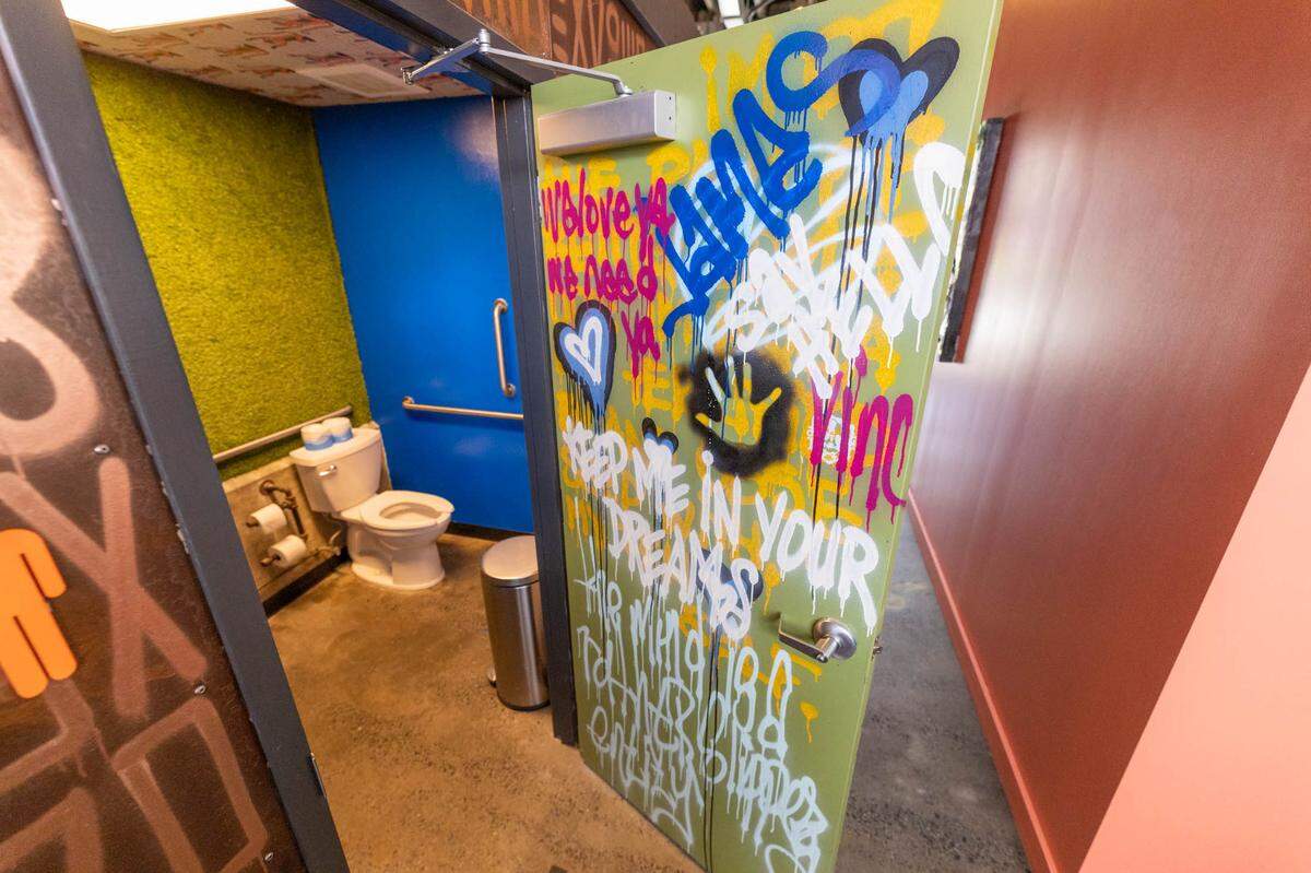 Creative bathroom decor at Noda Company Store Canteen in Camp North End.
