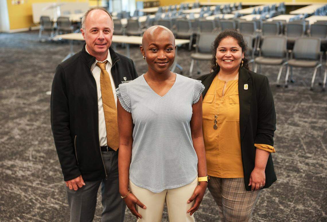 Dr. Chris Burns, left, medical student Adunoluwa Akinola, center and Dr. Deeksha Sikri stand in a large classroom inside Wake Forest University School of Medicine’s new Charlotte campus. Akinola has wanted to be a doctor since she was 6.