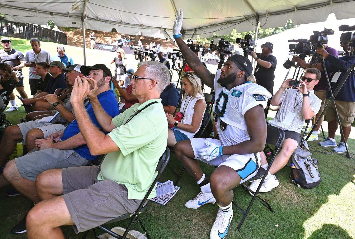 Carolina Panthers linebacker Brian Burns, right, raises his hand to ask rookie quarterback Bryce Young a question following the team’s joint practice with the New York Jets on Wednesday, August 9, 2023 at Wofford College in Spartanburg, SC.