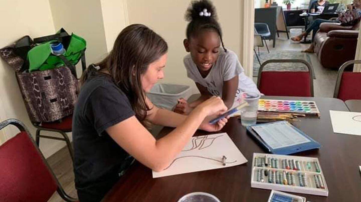 Poet and visual artist Shane Manier teaches an art workshop at Brookhill Community Resource Center in Charlotte. Manier founded Guerilla Poets, an outreach group that uses the healing power of art and poetry to help kids, teens and adults grapple with difficult emotions. The group holds workshops in shelters, schools, and at nonprofit agencies across the Charlotte area.