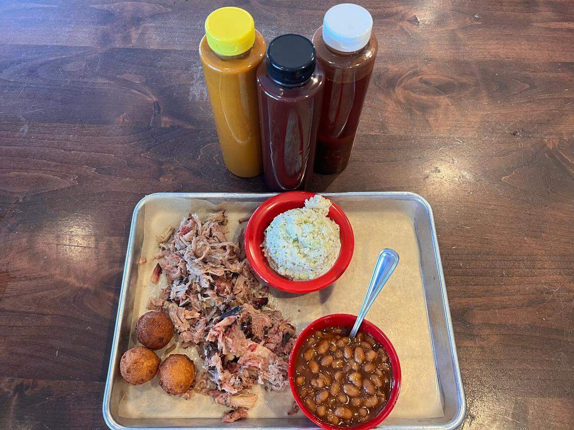 521 Barbecue’s pulled pork, coleslaw, baked beans and hush puppies.