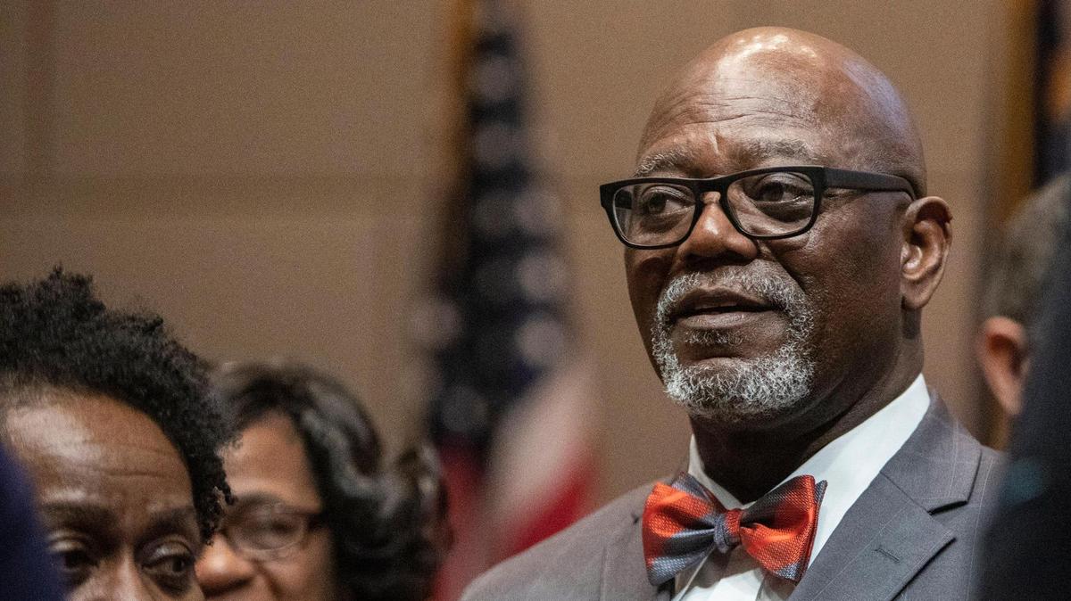 Commissioner George Dunlap, of District Three, stands with his family at the Charlotte-Mecklenburg Government Center Monday, Dec. 5 in Charlotte, NC.